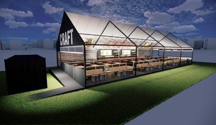 CRAFT Beer Market A modern, greenhouse-style restaurant labeled "CRAFT" features large windows, outdoor lighting, wooden seating sections, and offers craft cocktails inside. Set on a grassy area with a small black building nearby.
